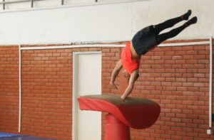 Man making a gymnastics in the gym